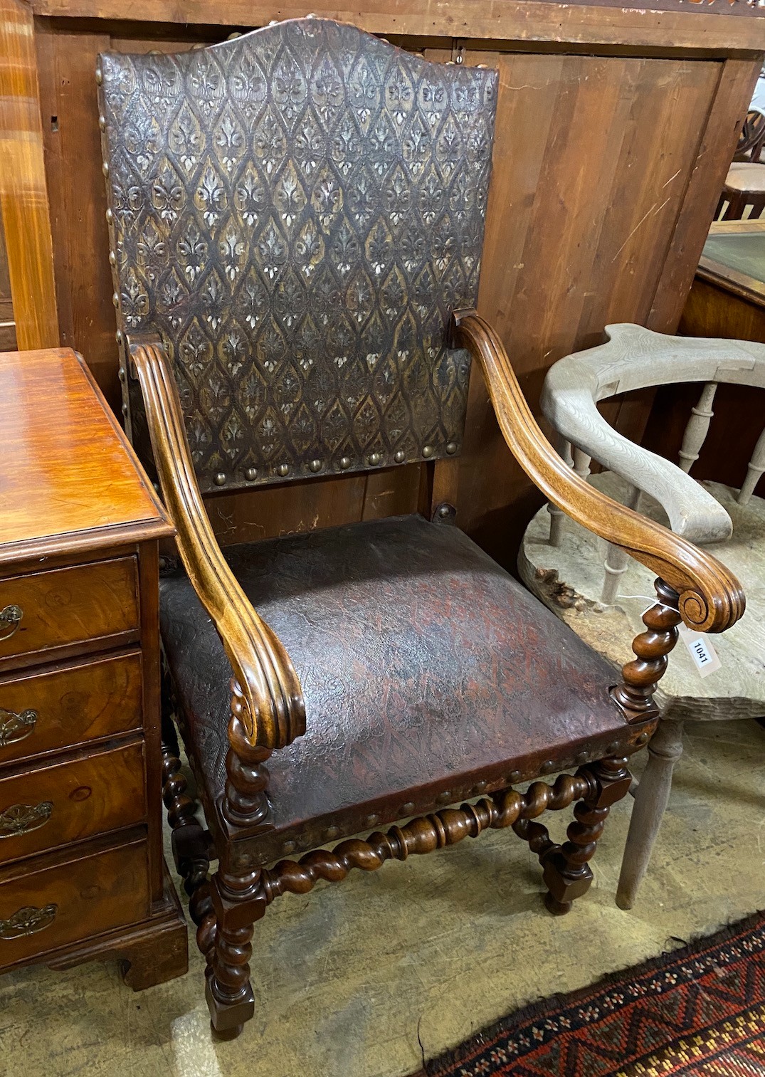 A French 19th century walnut and leather fauteuil, width 59cm, depth 60cm, height 115cm